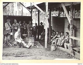 YALU AREA, NEW GUINEA, 1945-07-30. SMOKO PERIOD FOR NO. 3 PLATOON, 2/1 FORESTRY COMPANY, ROYAL AUSTRALIAN ENGINEERS