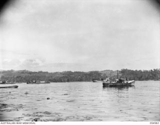 NEW GUINEA, 1943-07-21. SECOND SHOT OF A PANORAMA OF ORO BAY (JOINS 054581 AND 054583). NOTE MISCELLANY OF SMALL CRAFT USED IN THESE WATERS