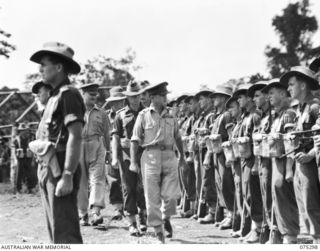 MADANG, NEW GUINEA. 1944-08-15. VX27 MAJOR-GENERAL A.H. RAMSAY, CBE, DSO, ED, GENERAL OFFICER COMMANDING 5TH DIVISION (1) INSPECTING MEMBERS OF THE 22ND INFANTRY BATTALION PRIOR TO THEIR EMBARKING ..