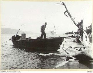 1943-05-07. GOODENOUGH ISLAND. FIRST JAP LANDING BARGE WASHED UP AFTER THE DESTRUCTION OF THE JAPANESE BISMARCK SEA CONVOY. THE 45 JAPANESE ON BOARD WERE EITHER KILLED OR CAPTURED. (NEGATIVE BY N. ..