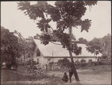 Two boys outside the church at Madoa, Ulawa, Solomon Islands, 1906 / J.W. Beattie
