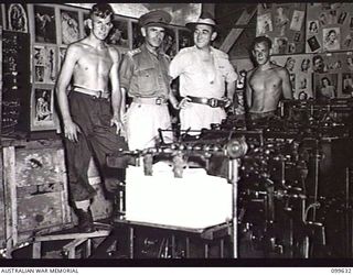 LAE, NEW GUINEA, 1946-01-09. PERSONNEL ENGAGED IN THE PRODUCTION OF THE AUSTRALIAN ARMY NEWSPAPER, GUINEA GOLD, BESIDE THE MILLER FLAT BED PRINTING PRESS. IDENTIFIED PERSONNEL ARE: PRIVATE (PTE) M. ..