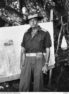 WEBER POINT, NEW GUINEA, 1944-02-14. NX110380 BRIGADIER C.E. CAMERON, MC, ED, COMMANDING OFFICER 8TH INFANTRY BRIGADE, PICTURED OUTSIDE HIS HEADQUARTERS