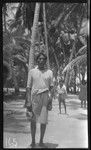 Man with boy and woman in background