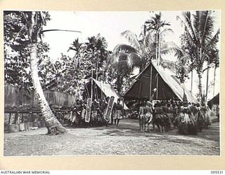WUNUNG, JACQUINOT BAY, NEW BRITAIN, 1945-08-25. THE NATIVE SING-SING HELD AT THE ALLIED INTELLIGENCE BUREAU TO MARK THE END OF HOSTILITIES