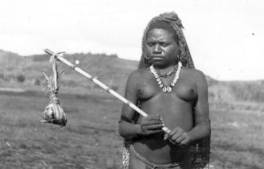 Mary bringing in a faecal sample for examiniation for parasites, Mount Hagen, 1934 [G. Heydon]