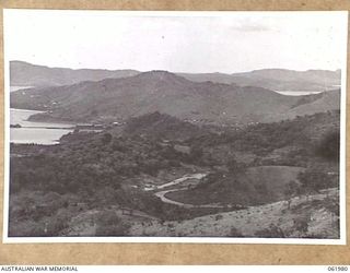 STOKES RANGE, PORT MORESBY AREA, NEW GUINEA. 1943-12-27. LOOKING FROM THE NORTHERN END OF STOKES RANGE TOWARDS PORT MORESBY WITH PORTION OF ELA BEACH VISIBLE IN THE LEFT BACKGROUND