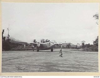 TOROKINA, BOUGAINVILLE. 1945-07-03. THE AVRO YORK AIRCRAFT, ENDEAVOUR, CARRYING HIS ROYAL HIGHNESS, THE DUKE OF GLOUCESTER, GOVERNOR-GENERAL OF AUSTRALIA, AND OFFICIAL PARTY, ARRIVING AT PIVA ..