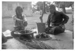 Kava-maker showing liquid to matāpule to assess its strength.