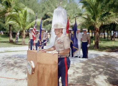 Marine Corps Colonel J. Karl Miller, commander Marine Barracks Guam, speaks at the Congressional Medal of Honor Monument dedication ceremony. The monument was erected to honor four Marines for heroism during World War II. They are Captain Louis Wilson, Jr., Private First Class (PFC) Leonard Mason, PFC Luther Skaggs and PFC Frank Witek