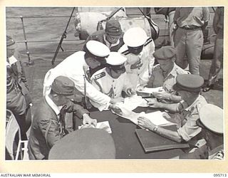 AT SEA OFF RABAUL, NEW BRITAIN. 1945-09-04. PRE- SURRENDER DISCUSSIONS ABOARD HMAS VENDETTA AT A SEA RENDEZVOUS OFF RABAUL BETWEEN REPRESENTATIVES OF LIEUTENANT GENERAL V.A.H. STURDEE, GENERAL ..