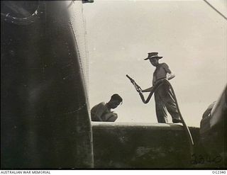 TADJI AIRSTRIP, AITAPE, NORTH EAST NEW GUINEA. 1945-03-30. REFUELLING A BEAUFORT BOMBER AIRCRAFT IN THE AITAPE SECTOR OF NEW GUINEA IS LEADING AIRCRAFTMAN (LAC) H. A. "ALF" KINGING OF TOWNSVILLE, ..