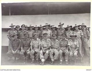 RABAUL, NEW BRITAIN, 1945-11-27. GROUP OF OFFICERS OF 5 BASE SUB AREA AT THEIR HEADQUARTERS IN MALAGUNA ROAD