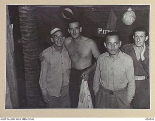 JACQUINOT BAY, NEW BRITAIN. 1945-04-15. PERFORMERS IN A CROWDED DRESSING ROOM DURING PREPARATIONS FOR THE NEXT SCENE IN A CONCERT STAGED BY MEMBERS OF 33 DOCKS OPERATING COMPANY, ROYAL AUSTRALIAN ..
