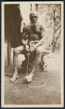 Elderly man making twine, Vanuatu,