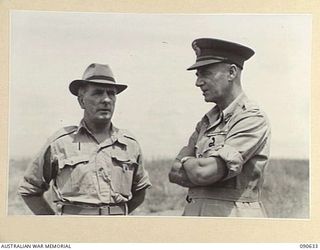 NADZAB, NEW GUINEA. 1945-04-14. SENATOR FRASER, ACTING MINISTER FOR THE ARMY (1), WITH LIEUTENANT GENERAL V.A.H. STURDEE, GENERAL OFFICER COMMANDING FIRST ARMY (2), AT THE AERODROME DURING THE ..