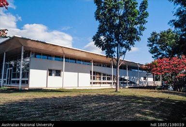 French Polynesia - Long white building, glass panelling around entrance