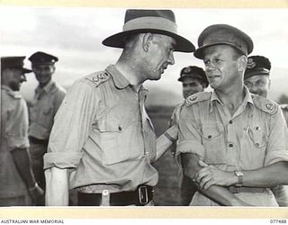 LAE AREA, NEW GUINEA. 1944-12-08. V145708 COLONEL J.H. RASMUSSEN, DIRECTOR GENERAL OF PUBLIC RELATIONS, LAND HEADQUARTERS, AUSTRALIAN MILITARY FORCES (1) CHATTING WITH SX9267 MAJOR V.E. ACOTT, ..