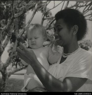 Fijian woman holding child