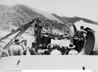 1943-04-08. NEW GUINEA. AERIAL TRANSPORT HAS PLAYED A TREMENDOUS PART IN THE NEW GUINEA CAMPAIGN AND AT WAU. CAUSED THE SPEEDY DEFEAT OF THE ADVANCING JAPANESE. HERE A 3 TON TRUCK CHASSIS IS BEING ..
