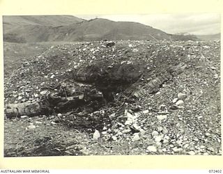 WANDOKAI, NEW GUINEA. 1944-04-17. THE EFFECTS AGAINST A JAPANESE BUNKER OF 13 ROUNDS OF 3 INCH HIGH EXPLOSIVE SHELL FIRED FROM A MATILDA TANK DURING TESTS CONDUCTED BY THE OPERATIONAL RESEARCH ..