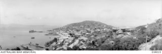 Port Moresby, Papua. 1942-07-15. A panoramic view of Port Moresby township, wharves and a section of the harbour