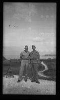 [Servicemen Elmer A. Ball and Scotty on hill]