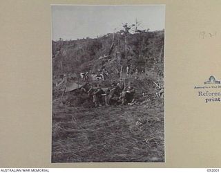WEWAK POINT, NEW GUINEA, 1945-05-11. THE HEADQUARTERS 2/4 INFANTRY BATTALION AREA. THE AREA, CONTAINING MANY "DOOVERS" (TEMPORARY STRUCTURES), IS KNOWN AS "SHANTY TOWN"