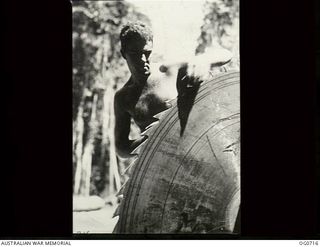 NADZAB, NEW GUINEA. C. 1944-02. LEADING AIRCRAFTMAN V. J. SALTER, PLENTY, TAS, SHARPENING A CIRCULAR SAW AT THE SAWMILL OPERATED BY NO. 62 MOBILE WORKS SQUADRON RAAF