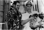 DeVere Baker and unidentified officer of the U.S. Navy's Pacific Oiler, Kawishiwi, at Pearl Harbor, Hawaii, Oct. 2, 1958