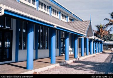 Tonga - white building with red roof and blue details