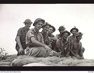 MOROBE, NEW GUINEA. 1943-08-13. TROOPS OF THE 162ND AUSTRALIAN LIGHT ANTI-AIRCRAFT BATTERY DURING A PRACTICE SHOOT OF THE BOFORS 40MM GUN L3. LEFT TO RIGHT:- QX14978 BOMBARDIER E. C. CHILCOTT; ..