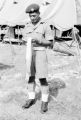 Malaysia, Republic of Fiji Military Forces soldier cleaning strap at camp