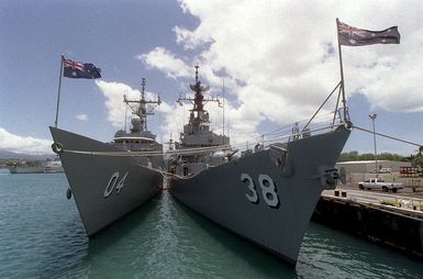 The Australian ships HMAS MELBOURNE (FFG 4) and HMAS PERTH (DDG 38) moored at Naval Station Pearl Harbor during exercise RIMPAC 98