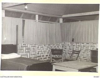 TOROKINA, BOUGAINVILLE. 1945-05-31. BEDSITTING ROOM OF GLOUCESTER HOUSE AT HEADQUARTERS 2 CORPS. THIS ACCOMMODATION WAS PLANNED IN THE EVENT OF A POSSIBLE VISIT OF THE DUKE OF GLOUCESTER TO THE ..