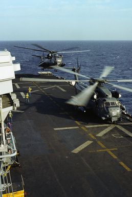 CH-53 Sea Stallion helicopters prepare to take off from the flight deck of the amphibious assault ship USS GUAM (LPH 9) during flight operations off the coast of Beirut. The ship is providing support to US Marines deployed in Lebanon as part of a multi-national peacekeeping force following confrontation between Israeli forces and the Palestine Liberation Organization