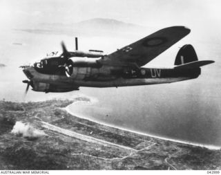 WEWAK, NEW GUINEA. 1944. A BEAUFORT BOMBER AIRCRAFT OF NO. 8 SQUADRON RAAF ABOVE THE SHORE-LINE DURING A BOMBING ATTACK ON WEWAK