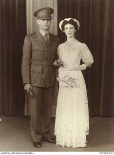 Studio wedding portrait of NX59611 Lieutenant (Lt) Herbert Arthur Warne and his bride Esma (nee Myers) on their wedding day. Lt Warne served in the 2/33 Battalion and was killed in action on 14 ..