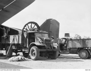 WARD'S DROME, NEW GUINEA. 1943-11-16. A THREE TON TRUCK OF THE 2/5TH AUSTRALIAN FIELD REGIMENT, 7TH AUSTRALIAN DIVISION CONTAINING THE PARTS OF A DISMANTLED LONG, 25-POUNDER GUN READY TO BE LOADED ..