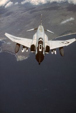 An F-4 Phantom II aircraft maneuvers to be refueled in flight by a KC-10 Extender aircraft over Hawaii during Exercise COPE CANINE '85