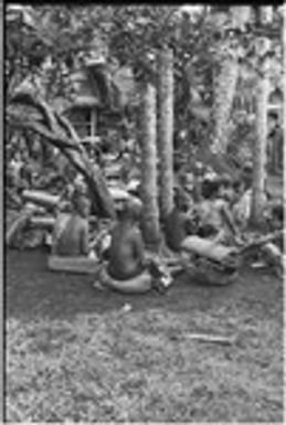 Mortuary ceremony, Omarakana: women with banana leaf bundles and mats for ritual exchange