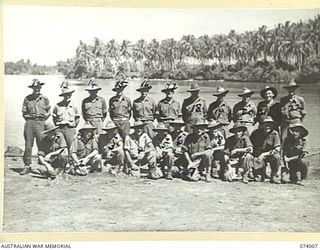 MILILAT, NEW GUINEA. 1944-06-19. MEMBERS OF THE CAMP STAFF OF HEADQUARTERS, 5TH DIVISION. IDENTIFIED PERSONNEL ARE:- Q46132 PRIVATE D.K. HEFFERNAN (1); QX50331 PRIVATE W.B. CROYDEN (2); QX36377 ..