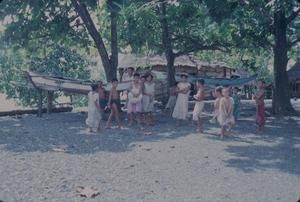 [Outrigger canoes and children on the shore in Safotu, Samoa]