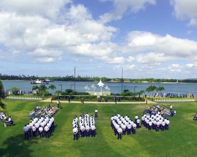 US Air Force (USAF) personnel assigned to the 15th Support Group (SG), assembles to watch the 15th Air Base Wing (ABW) Change of Command Ceremony held a Hickam Air Force Base (AFB), Hawaii. During the Ceremony USAF Colonel (COL) Wayne E. Louis relinquished command to USAF COL Albert F. Riggle