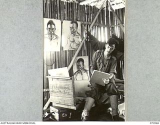 KAKAKOG, NEW GUINEA. 1944-04-06. NX191007 LIEUTENANT E. A. D. WATSON, AN OFFICIAL WAR ARTIST OF THE MILITARY HISTORY SECTION, AT WORK AT HEADQUARTERS AUSTRALIAN NEW GUINEA ADMINISTRATIVE UNIT