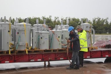 Commonwealth Utility Corporation power employees prepare transformers for transport. These transformers were delivered to aid in the efforts to restore long-term power to Saipan after Typhoon Soudelor caused serious damage back in August, 2015. A total of 486 transformers will be delivered to Saipan by the end of the month.