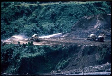 Disposing of the overburden: sluicing into the pinei river (2) : Bougainville Island, Papua New Guinea, April 1971 / Terence and Margaret Spencer