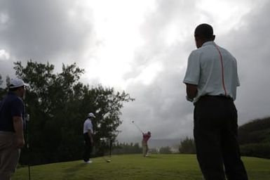 Barack Obama plays golf with Prime Minister Najib Razak, Joe Paulsen, and Mike Brush in Kaneohe Bay, Hawaii, December 24, 2014