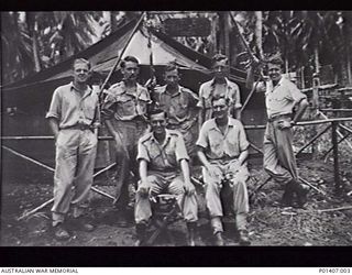 MADANG, NEW GUINEA. 17 MARCH 1945. RAAF NORTHERN COMMAND HEADQUARTERS STAFF. LEFT TO RIGHT: BACK ROW: PAT KENNEDY, JACK GUINEY, BILL GIBBS, HARRY BIGNELL, M. JOSEPH ENGLISH; FRONT ROW: KEITH ..