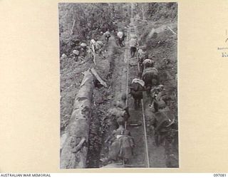 BOUGAINVILLE. 1945-09-26. JAPANESE TROOPS START DOWN BARGES HILL ON THEIR WAY TO TOROKINA PRISONER OF WAR COMPOUND. THE AREA IS NOW UNDER THE CONTROL OF 3 DIVISION